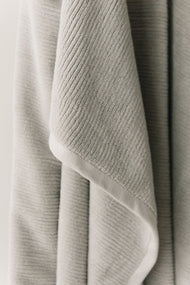 Draps de bain en éponge côtelée